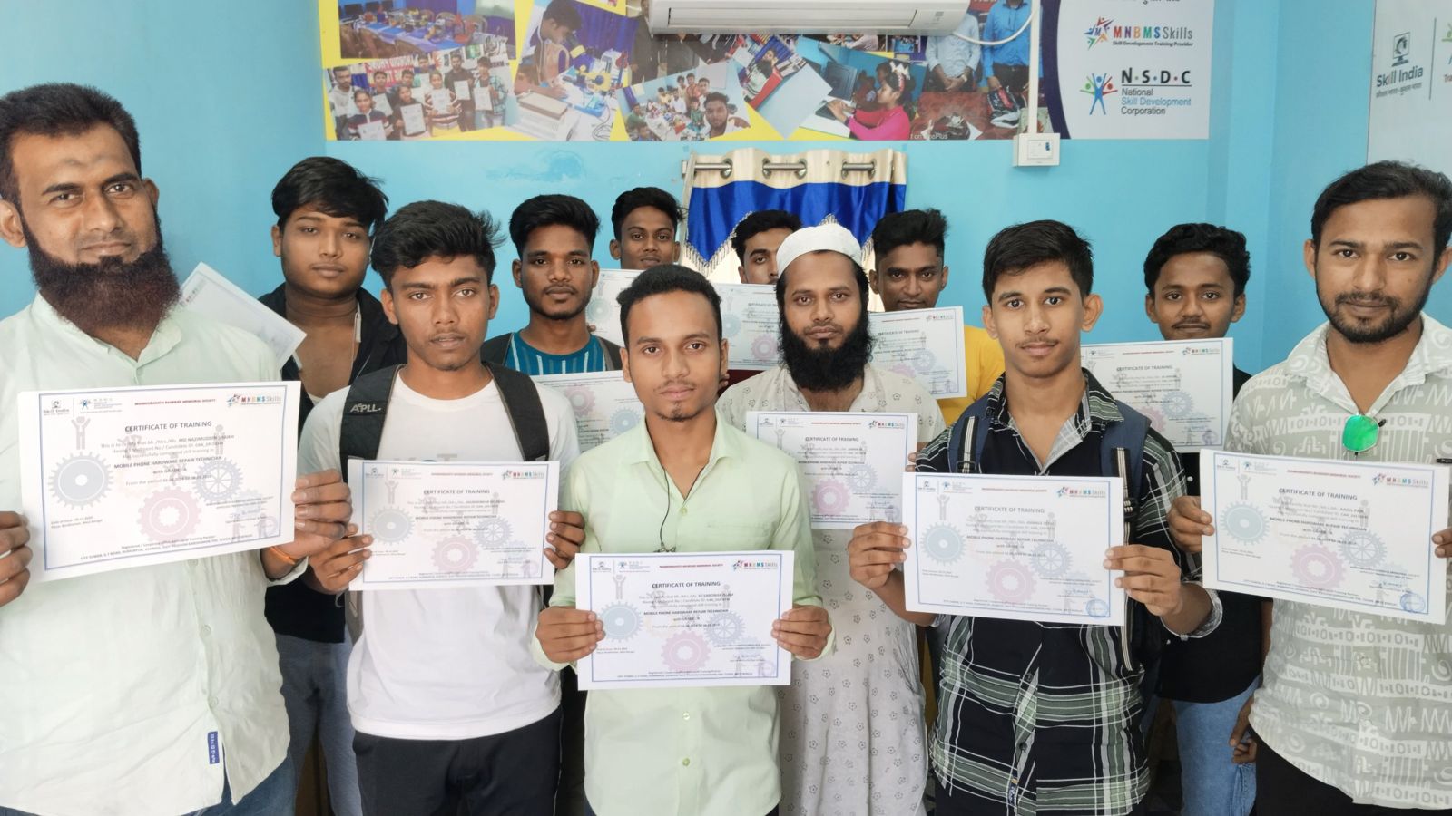 Students holding Certificates of Training