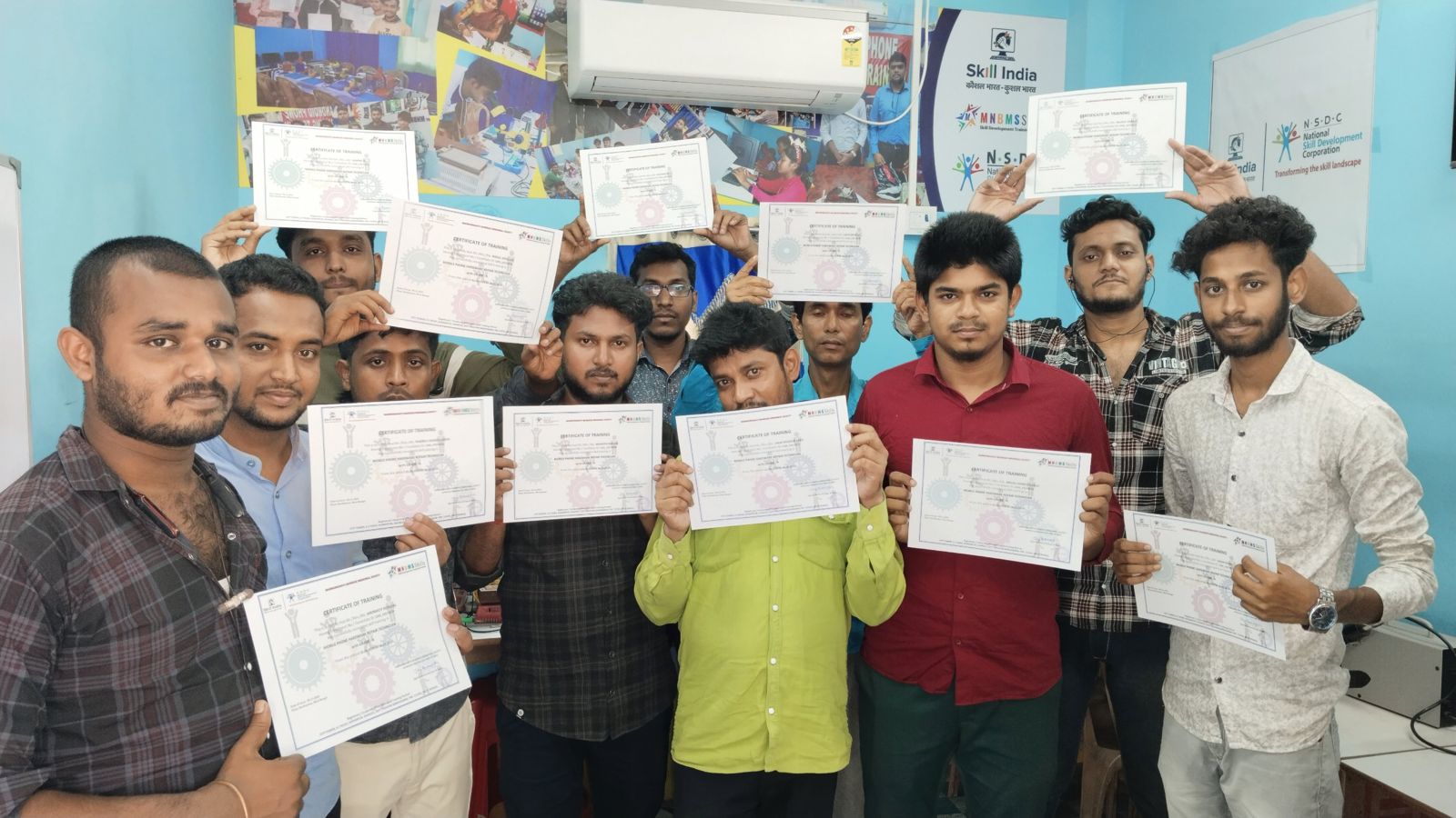 Batch of students holding certificates